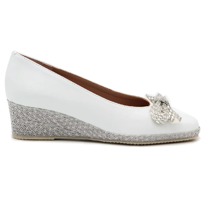 Versatile and stylish women's shoes for everyday chicBruno's  White Leather wedge shoe with bow