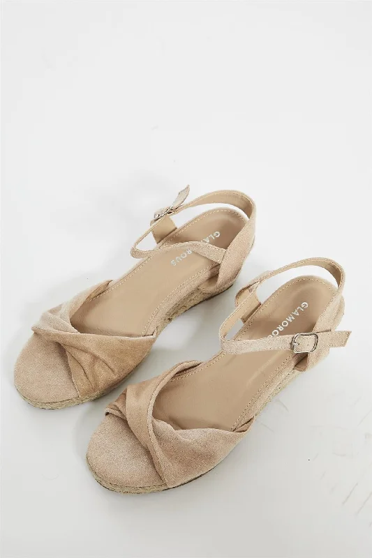 Feminine and romantic women's shoe designsNude Twist Front Wedge Sandals